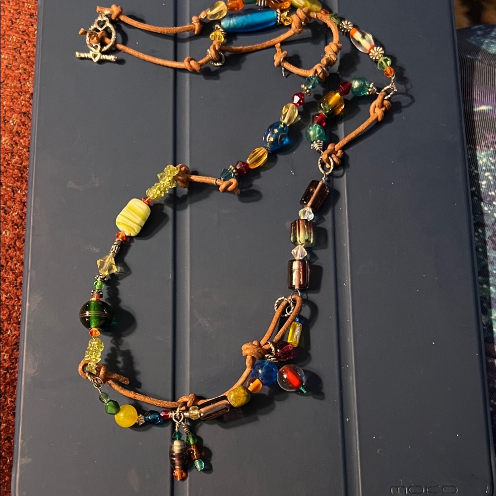 Hand wrapped leather and glass beaded necklace 
25””